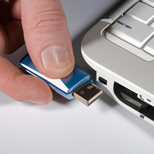 Inserting a flash drive into a laptop's USB port
